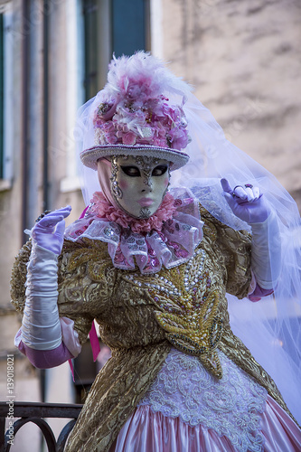 VENICE, ITALY - February 25, 2017: Unidentified persons in Venice mask for the Carnival