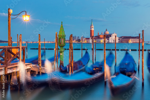 Gondolas in Venice at night © sborisov