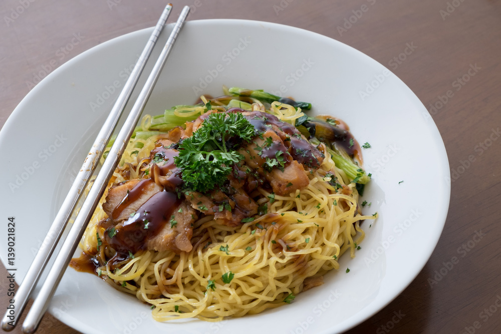 chinese noodle with sweet red pork on the table