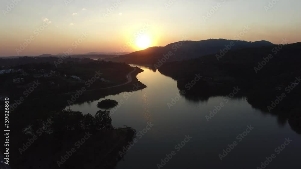 Flying over a lake on a sunrise Flying over a lake on a sunrise