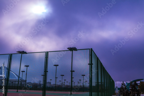 Lanterns light in cloudy weather on the tennis court