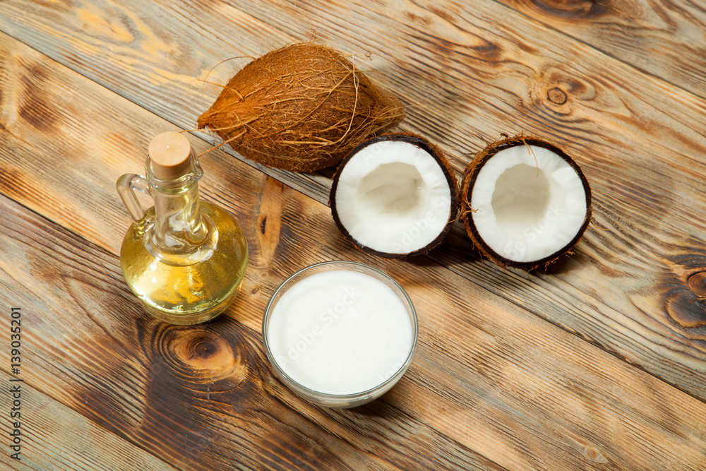 Coconut oil, on a wooden background Coconut oil, on a wooden background