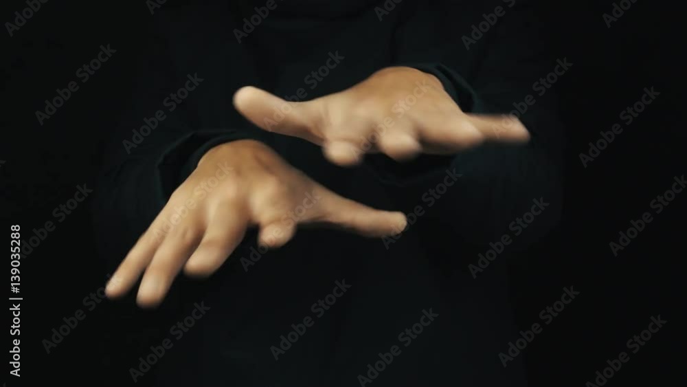 Caucasian male hand in long sleeve jacket making hip hop finger show off gestures on black background, close up isolated Caucasian male hand in long sleeve jacket making hip hop finger show off gestures on black background, close up isolated