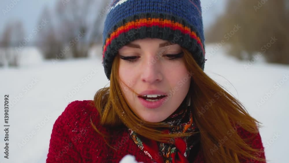Beautiful Young Smiling Winter Girl Blowing Snow On Field in super slow motion 120fps Beautiful Young Smiling Winter Girl Blowing Snow On Field in super slow motion 120fps