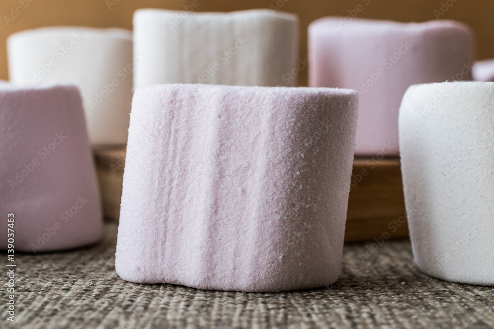Stack of Marshmallows on wooden surface. Stack of Marshmallows on wooden surface.