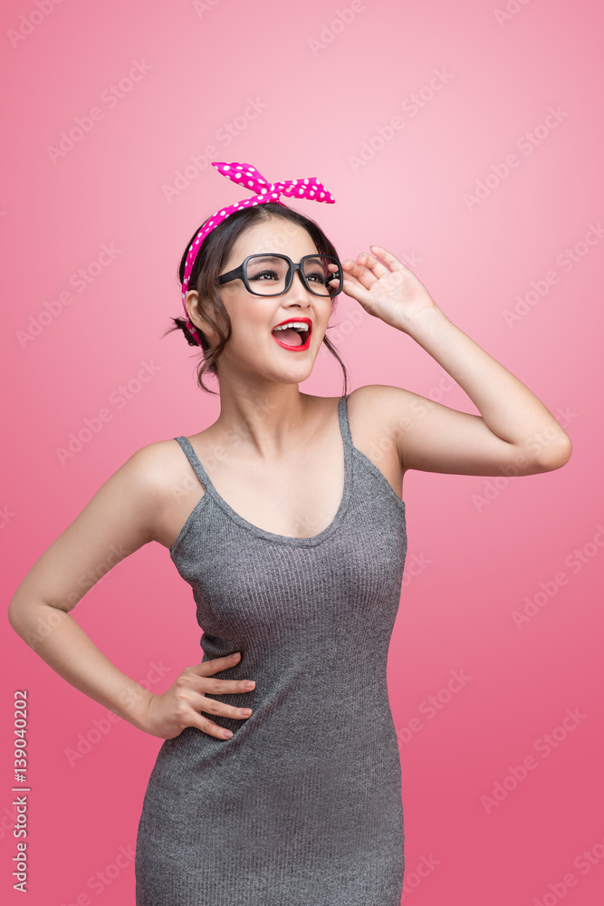 Fashion portrait of asian girl with sunglasses standing on pink background. Fashion portrait of asian girl with sunglasses standing on pink background.