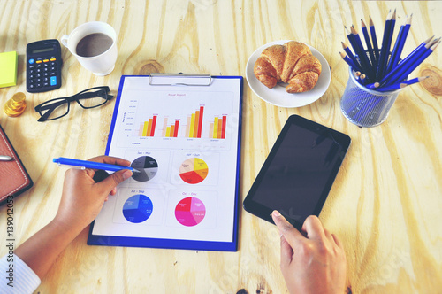 Wallpaper Mural beautiful business women  working use cellphone while working and read business document  , business concept , Torontodigital.ca