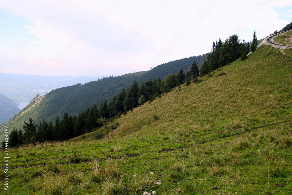 Obraz premium Travel to Sankt-Wolfgang, Austria. The road with view on the mountains and a lake.