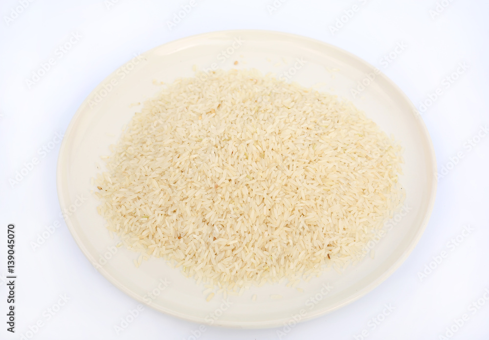 Jasmine white rice on white plate against white background Jasmine white rice on white plate against white background