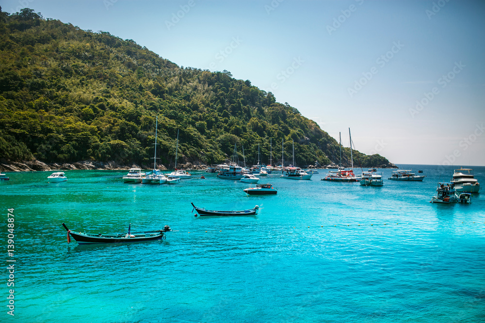 Landscape of many boats floating on the deep blue sea . Landscape of many boats floating on the deep blue sea .