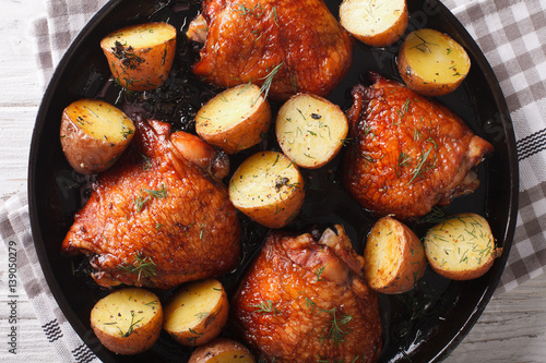Maple chicken thighs and baby potatoes close-up. horizontal top view