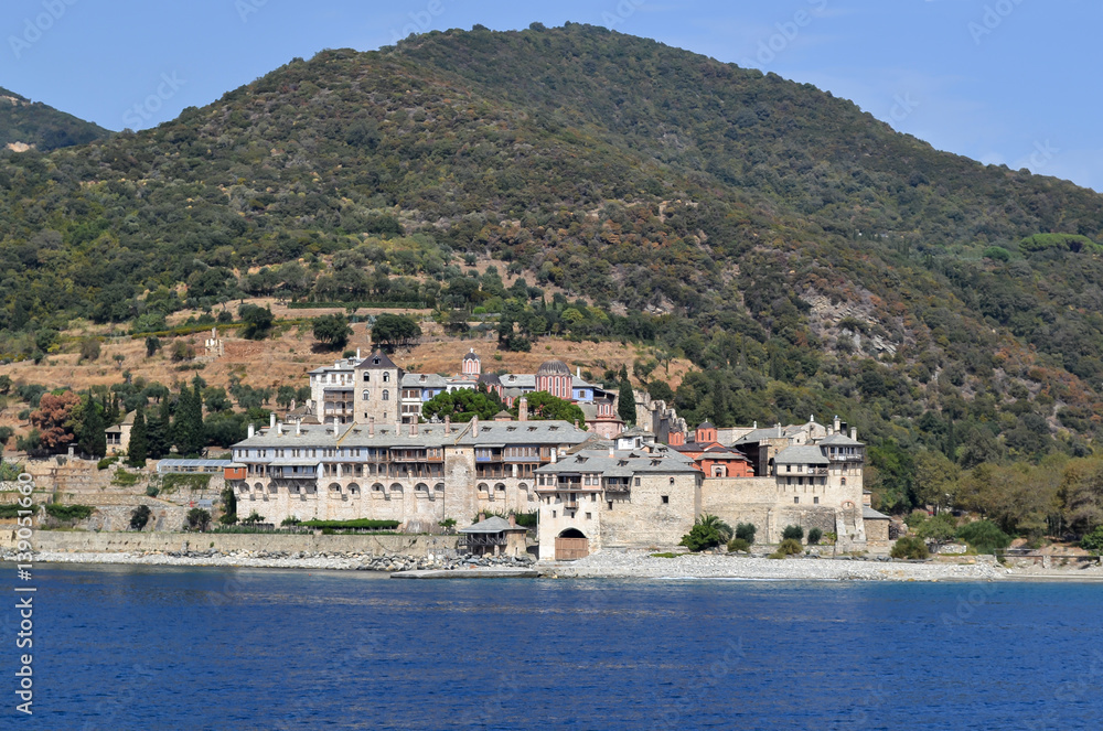 Orthodox Greek monastery on Mount Athos. View from sea. Xenophon.