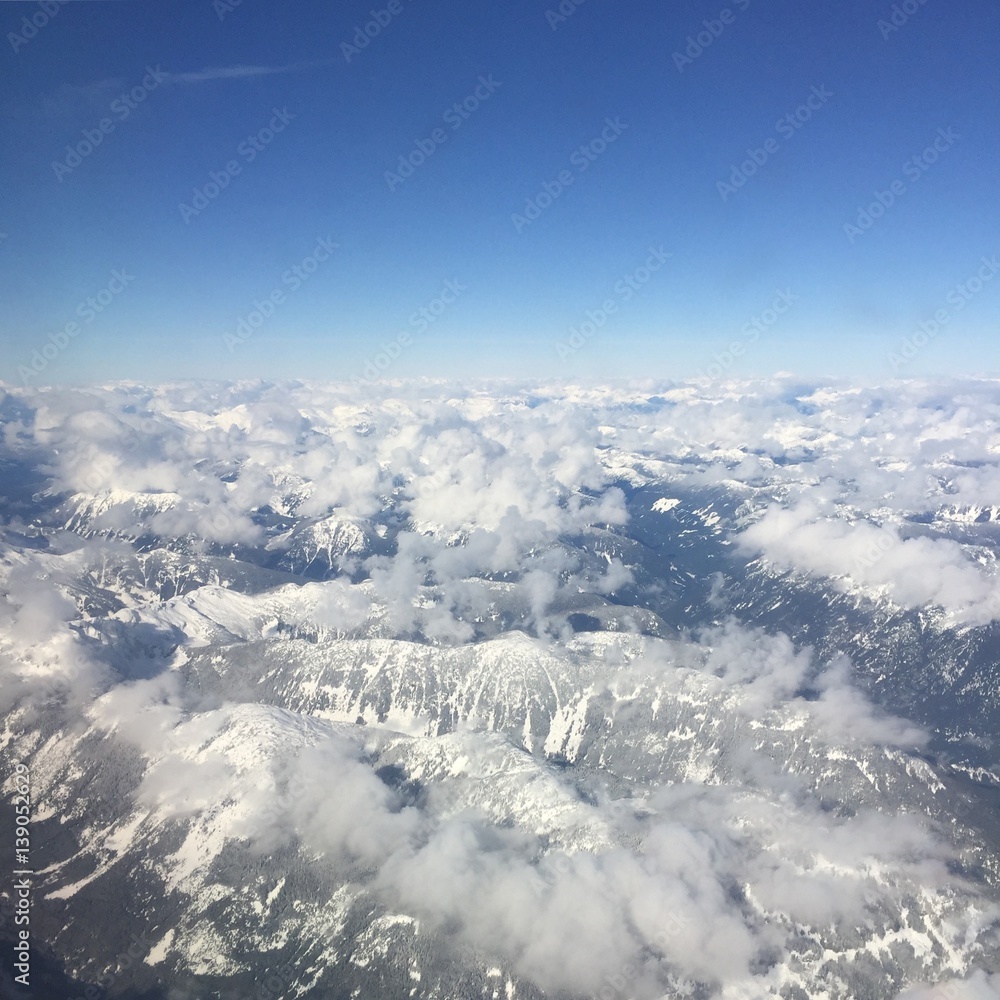 Fototapeta premium Aerial view of snow covered mountains