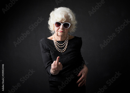 Old woman flipping people off