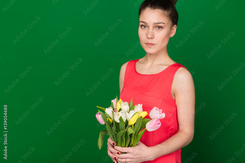 Beautiful girl with a bouquet of tulips Beautiful girl with a bouquet of tulips