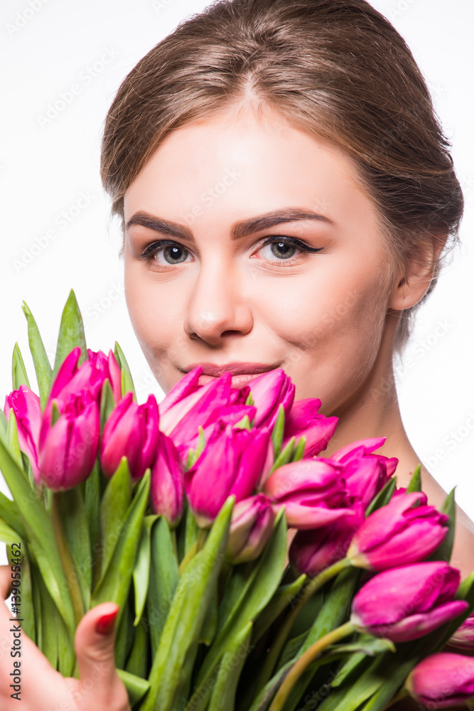 Close-up portrait of pretty woman with flowers near her face Close-up portrait of pretty woman with flowers near her face
