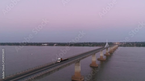 Wallpaper Mural Aerial view of Bridge over khong river at twilight sky.
bridge in the night of Second Thai–Lao Friendship Bridge.
Over the Mekong connects Mukdahan Province in Thailand with Savannakhet in Laos.

 Torontodigital.ca