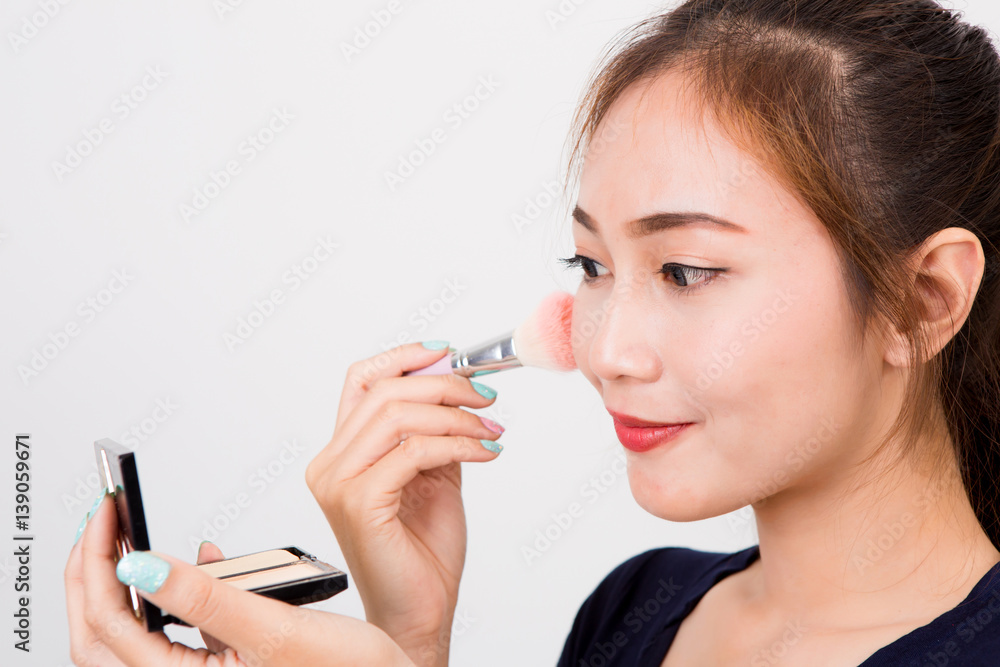 Young happy smiling woman with cosmetics brush Young happy smiling woman with cosmetics brush