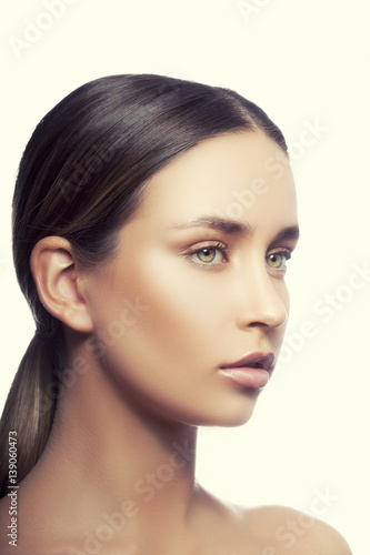 Young girl portrait with toned skin with natural make-up