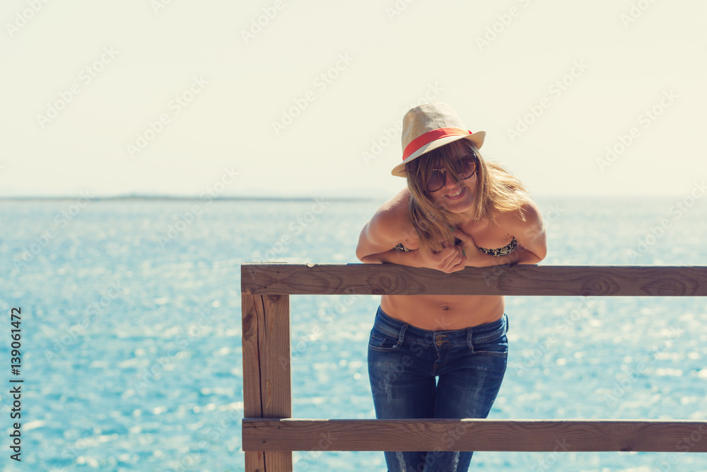 Smiley cute girl enjoying at the sea / ocean. Smiley cute girl enjoying at the sea / ocean.