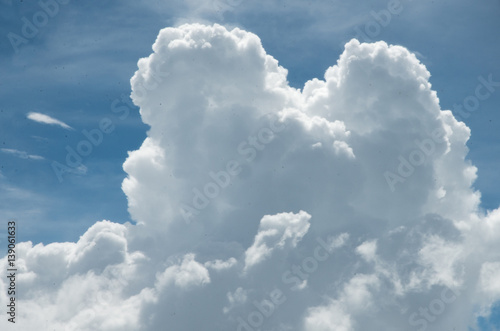 Clouds and sky as seen through window of an aircraft