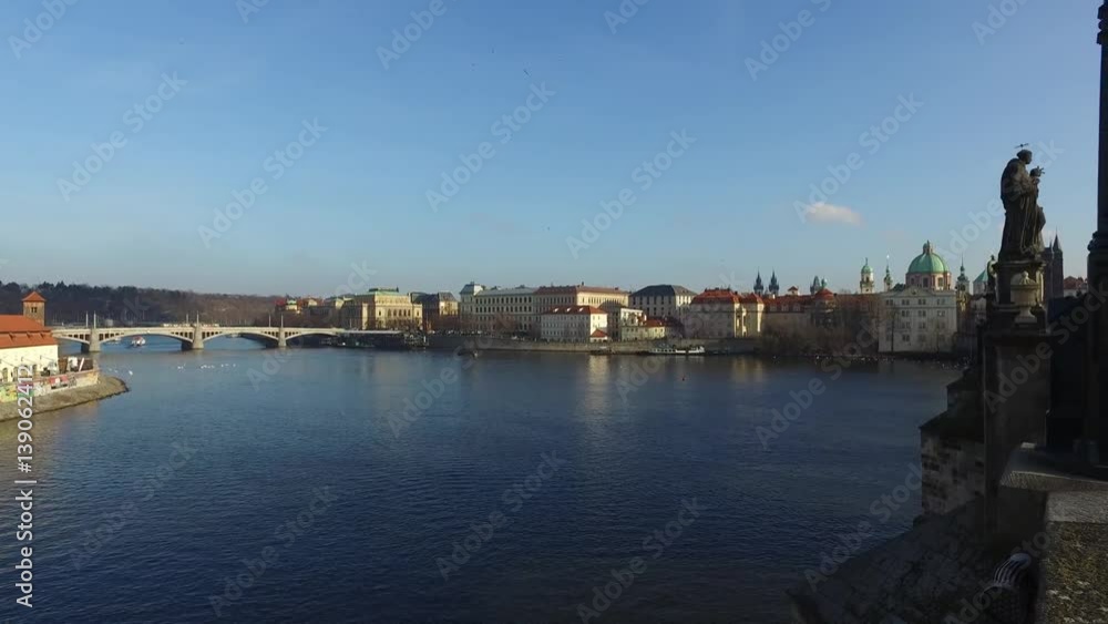 PRAGUE, CZECH REPUBLIC - DECEMBER 31, 2015 : Landscape view from Charles Bridge which crosses over Vltava river in Prague. Prague is the historical capital of Bohemia. PRAGUE, CZECH REPUBLIC - DECEMBER 31, 2015 : Landscape view from Charles Bridge which crosses over Vltava river in Prague. Prague is the historical capital of Bohemia.