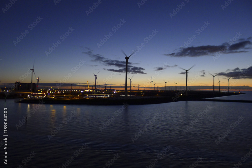 Energy windmills in sunset