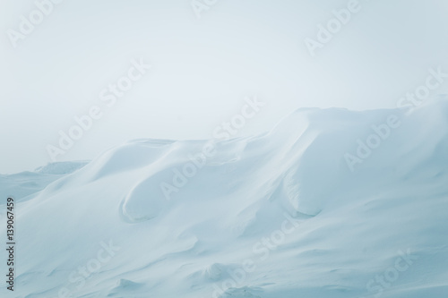 A beautiful, minimalist landscape of snowdrift in Norway. Clean, light, high key, decorative look. © dachux21