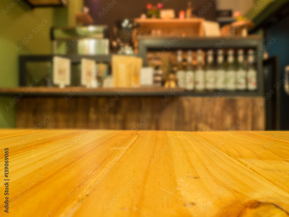 wooden table in front of abstract blurred background