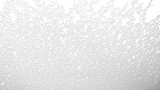 White with gray snow on glass. Use for backgrounds and textures.