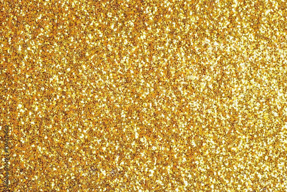 Sprinkle glitter gold dust on a black background with copy space - obrazy, fototapety, plakaty 