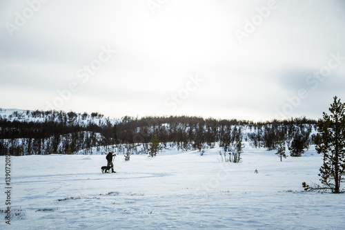 A beautiful, snowy Norwegian landscape with a skiers. 