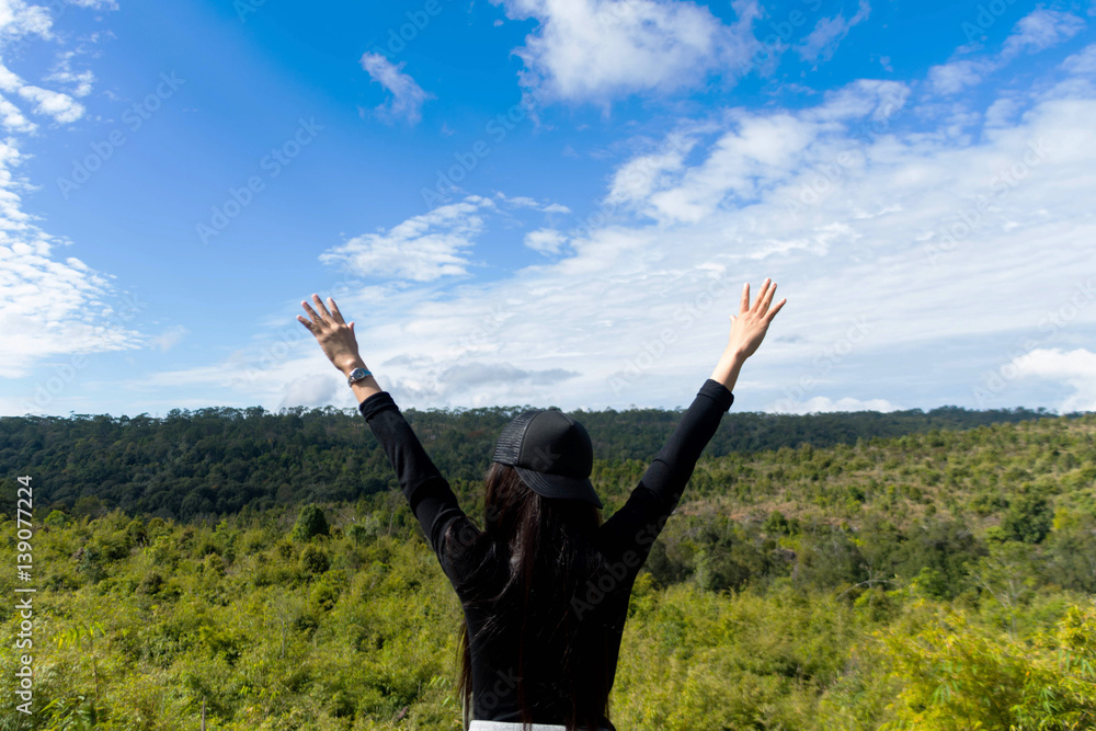 woman stand on mountain with beautiful blue sky. subject is blurred woman stand on mountain with beautiful blue sky. subject is blurred