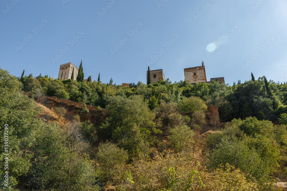View from below of some towers of The Alhambra, Granada, Spain