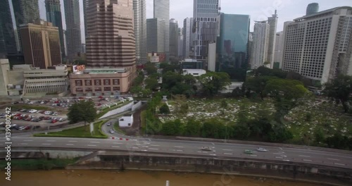 Wallpaper Mural Aerial Slider Shot Along Kuala Lumpur Highway and Highrise Towers
 Torontodigital.ca