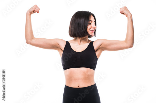 sport fitness woman flexing show her biceps muscles, young healthy smile girl athletic body, perfect figure