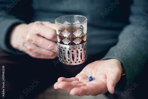 Wallpaper Mural A pill in someone's hand Torontodigital.ca