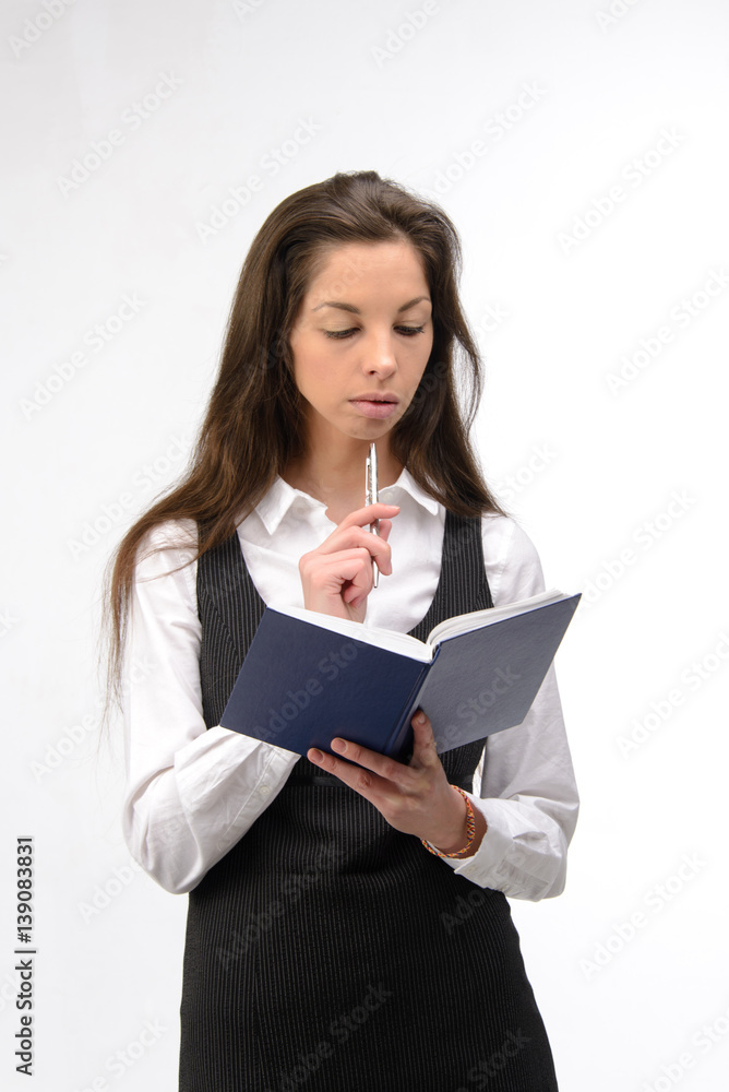 Beautiful young business woman with notebook, on white Beautiful young business woman with notebook, on white