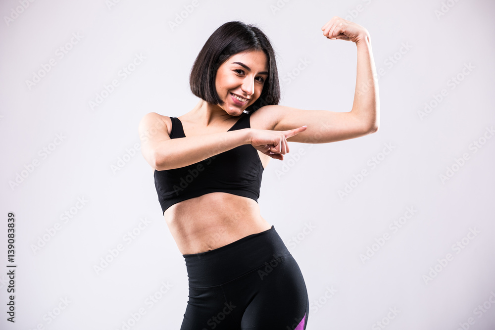 Portrait of a happy elegant woman showing her biceps Portrait of a happy elegant woman showing her biceps
