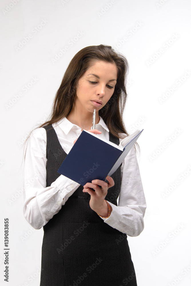 Beautiful young business woman with notebook, on white Beautiful young business woman with notebook, on white