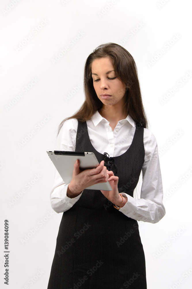 Attractive young business woman holding a digital tablet, on white Attractive young business woman holding a digital tablet, on white