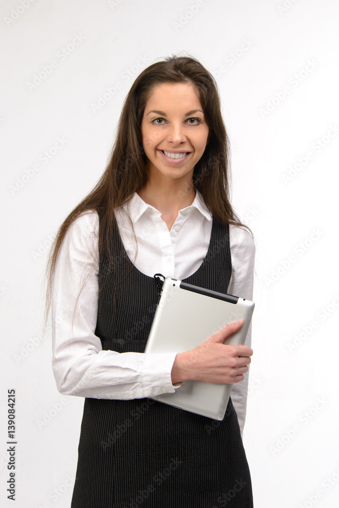 Attractive young business woman holding a digital tablet, on white Attractive young business woman holding a digital tablet, on white