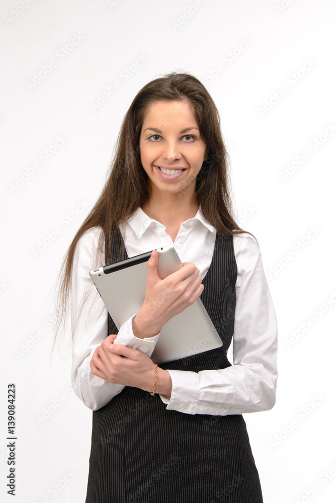 Attractive young business woman holding a digital tablet, on white Attractive young business woman holding a digital tablet, on white
