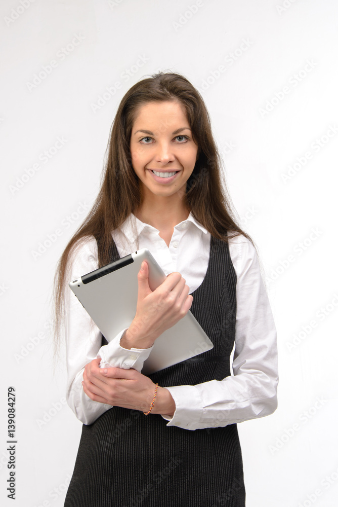 Attractive young business woman holding a digital tablet, on white Attractive young business woman holding a digital tablet, on white