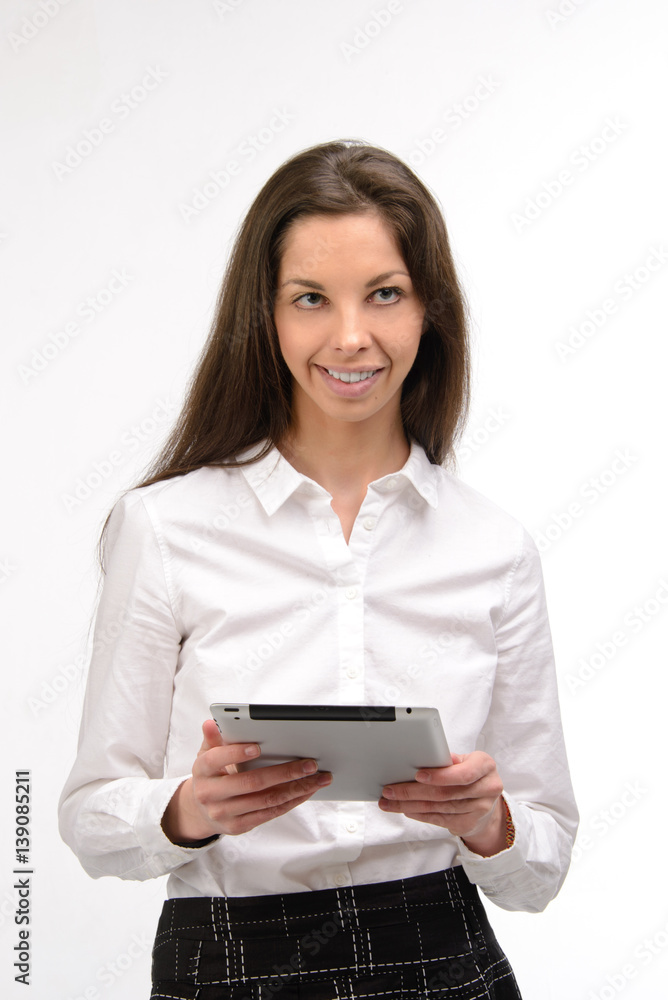 Attractive young business woman holding a digital tablet, on white Attractive young business woman holding a digital tablet, on white