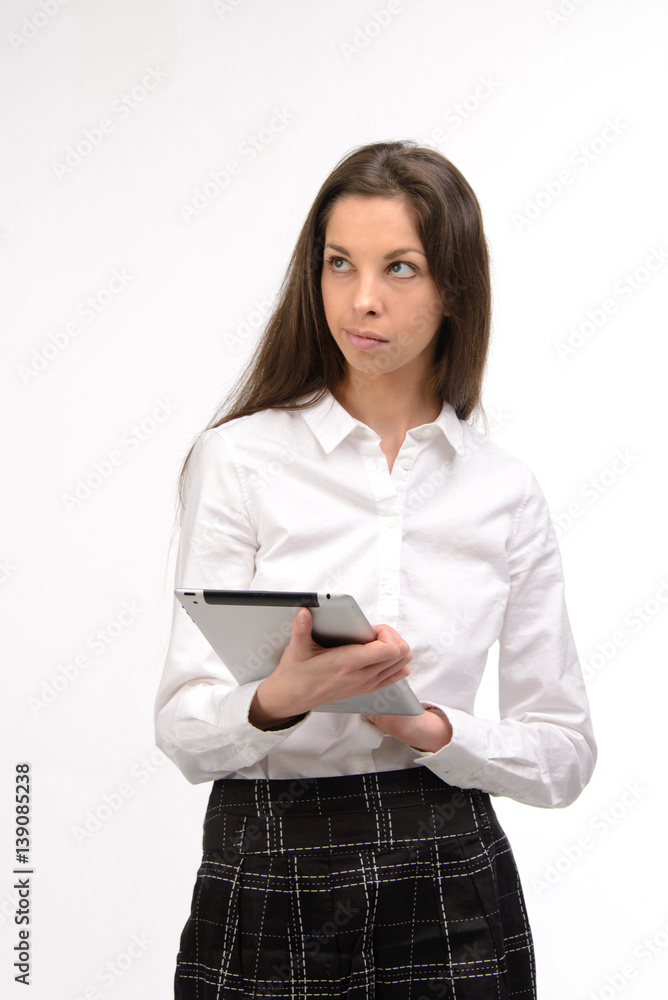 Attractive young business woman holding a digital tablet, on white Attractive young business woman holding a digital tablet, on white