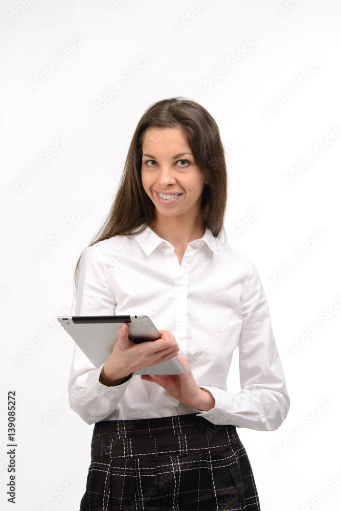 Attractive young business woman holding a digital tablet, on white Attractive young business woman holding a digital tablet, on white