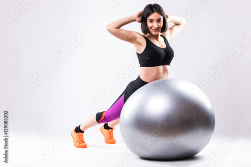 one caucasian woman exercising fitness ball workout posture in isolated on white background photo