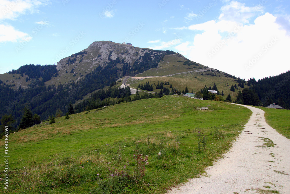 Travel to Sankt-Wolfgang, Austria. The road between the fields in the mountains.