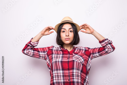 Happy young woman in casual clothes and hat photo